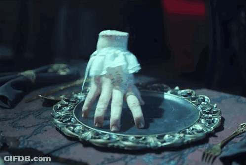 Hand In White Lace Glove On Silver Plate GIF