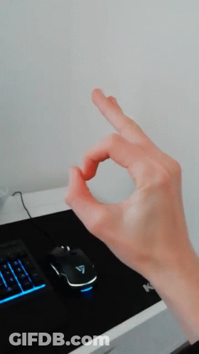 Hand Making OK Sign In Front Of Computer Mouse And Keyboard GIF