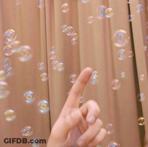 Hand Pointing At Soap Bubbles GIF