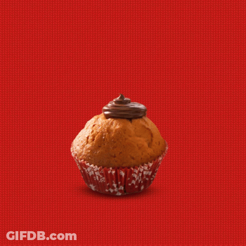 Hand Putting Raspberry On Cupcake GIF