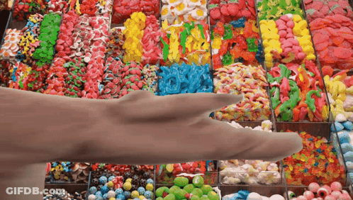 Hand Reaching For Candy Display GIF