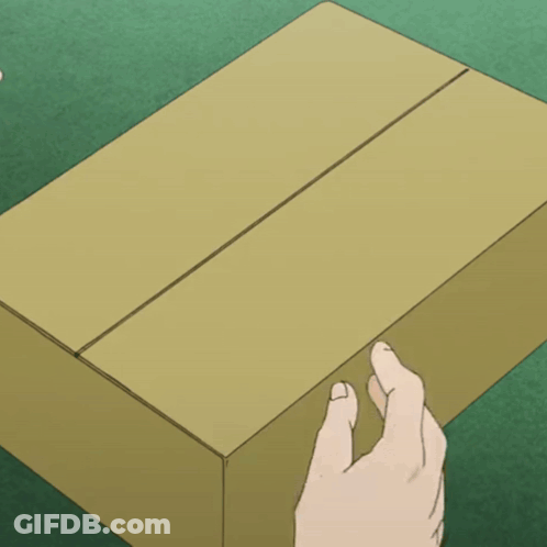 Hand Reaching For Cardboard Box On Green Surface GIF