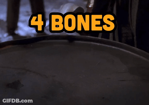 Hand Reaching For Pile Of 4 Bones GIF