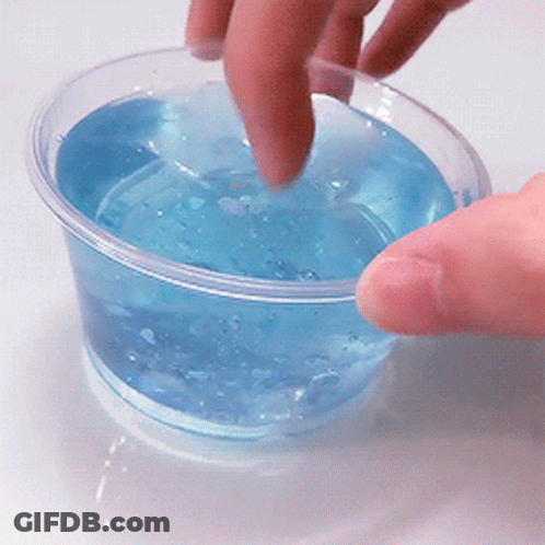 Hand Reaching Into Blue Liquid GIF