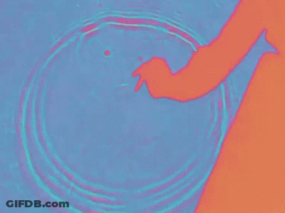 Hand Reaching Into Water GIF