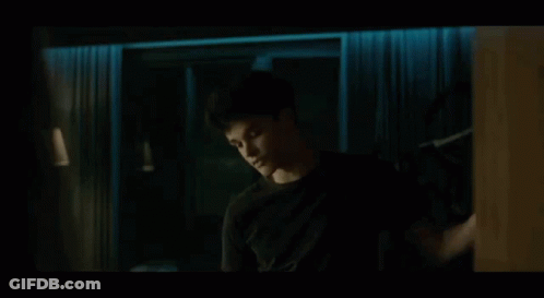 Hand Reaching Toward Door In Dark Room GIF
