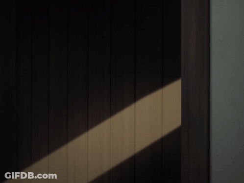 Hand Reaching Towards Another Person's Face GIF