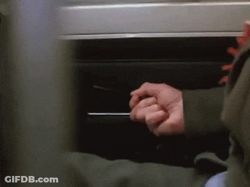 Hand Reaching Under Table GIF