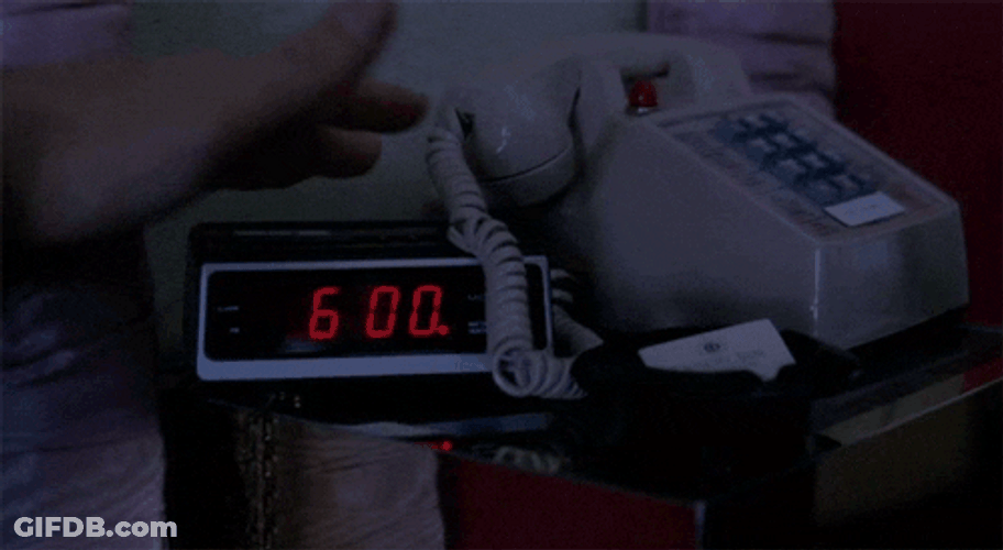 Hand Stopping Alarm Clock GIF
