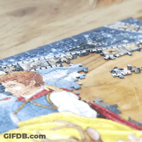 Hand Trying To Fit In Puzzle Piece GIF