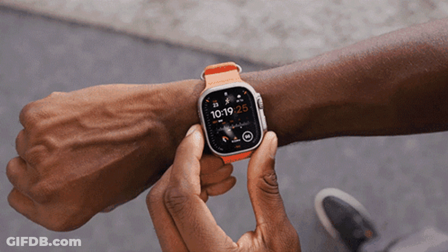 Hand Turning On Orange Apple Watch GIF