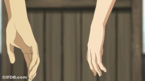 Hands Holding Each Other In Front Of Wooden Fence GIF