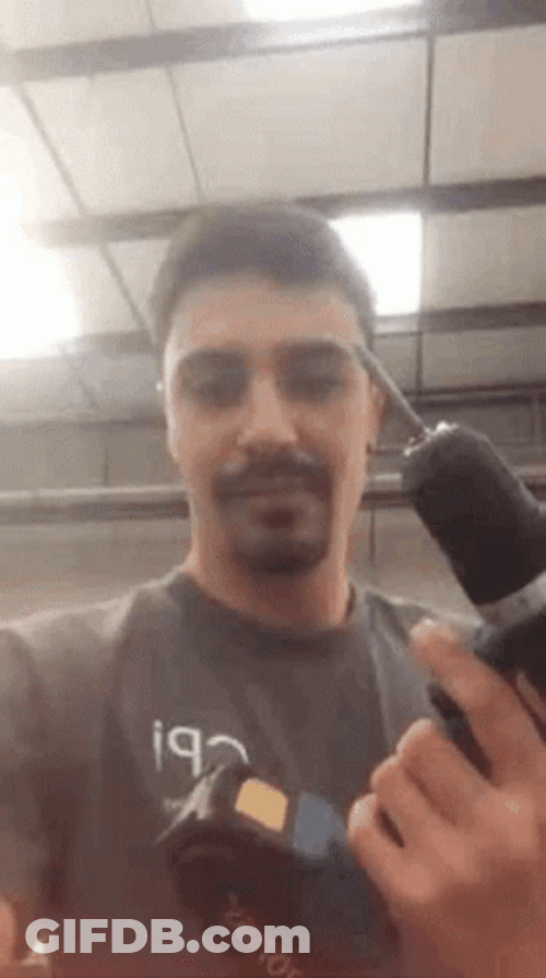 Handsome Guy Showing His Handheld Drill GIF