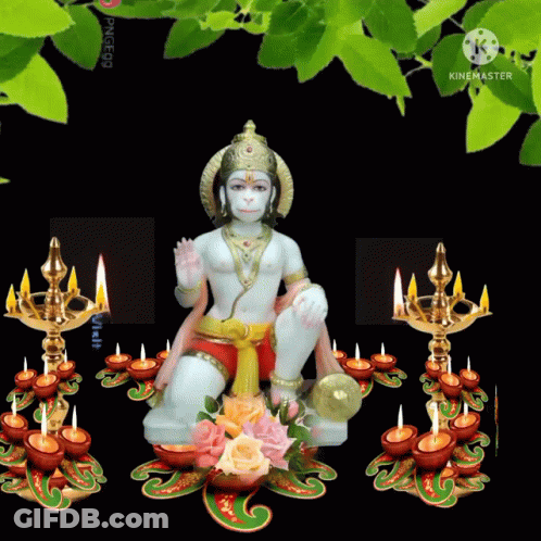 Hanuman Statue Surrounded By Lit Candles GIF