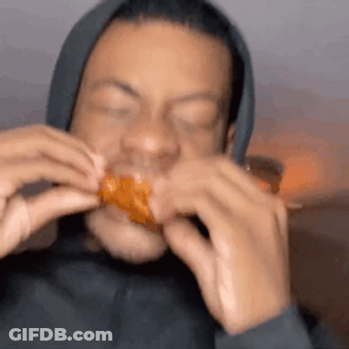 Happily Eating Chicken Wing GIF