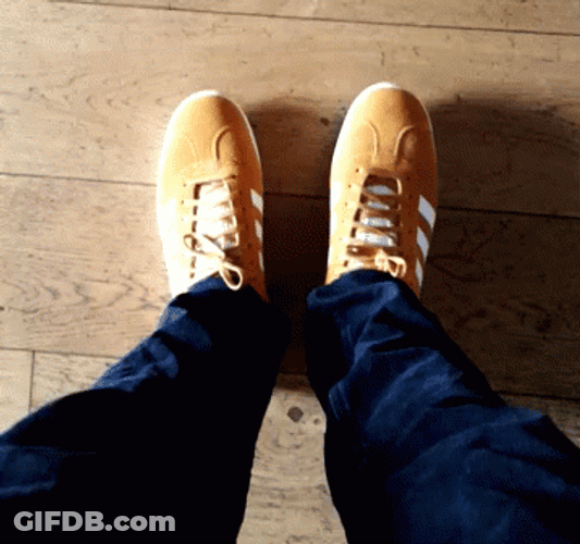 Happily Wearing Yellow Adidas Shoes GIF