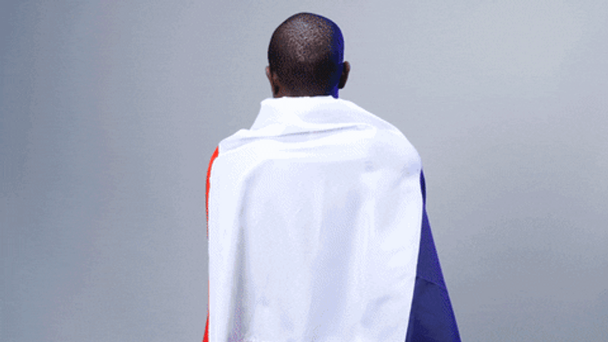 Happy Bastille Day Football Player Holding Flag GIF
