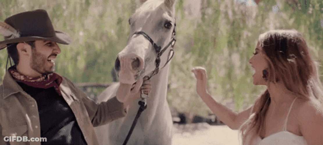 Happy Becky G Touching White Horse GIF