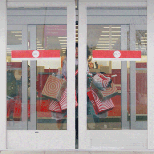 Happy Black Friday Woman Leaving Store With Bags GIF