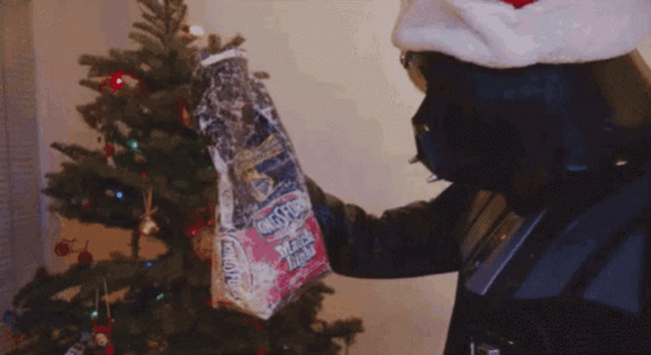 Happy Christmas Harry Black Mascot Giving Gifts GIF