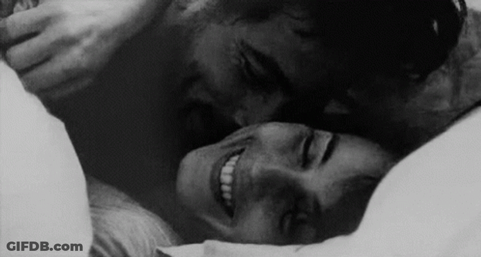Happy Couple In The Bed Cuddling GIF