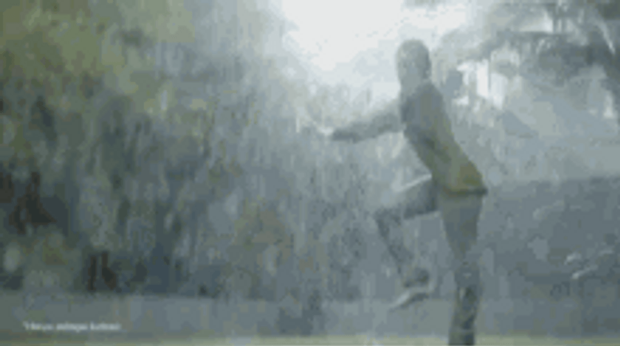 Happy Girl Enjoying And Dancing In The Rain GIF