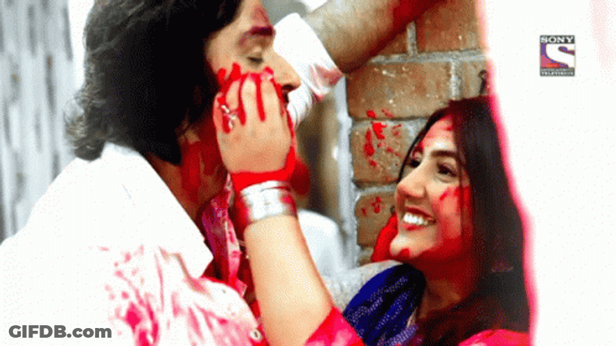 Happy Holi Couple Painting Face GIF