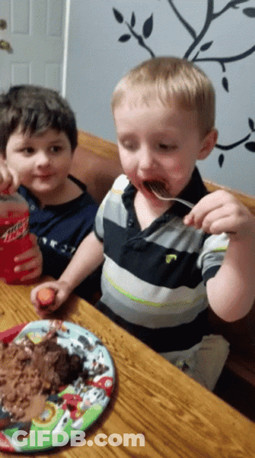 Happy Kid Eating Cake GIF
