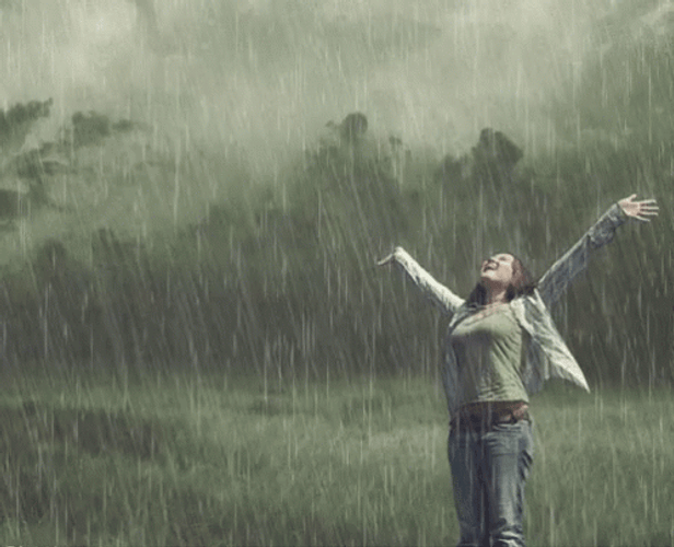 Happy Woman Enjoying Rain GIF