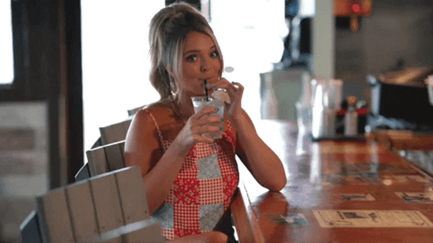 Happy Woman Raising Glass Of Margarita GIF