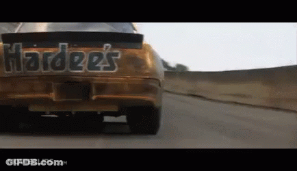 Hardees Car Driving Down A Road GIF