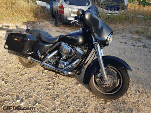 Harley Davidson Motorcycle On Gravel Road GIF