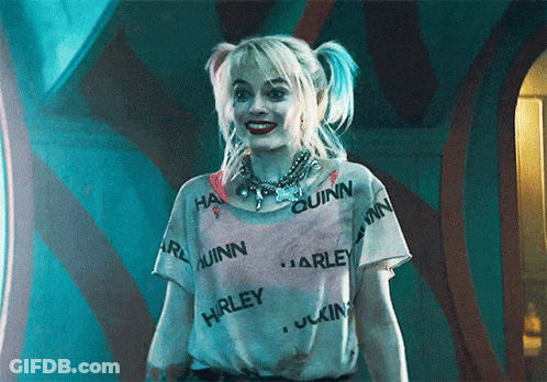 Harley Quinn Is Wearing A White Shirt With Harley Quinn Written All Over It . GIF