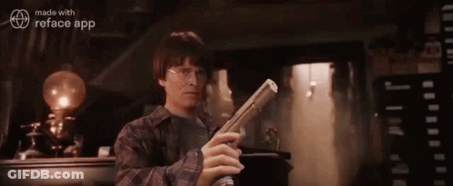 Harry Potter Is Holding A Newspaper In His Hand In A Room . GIF