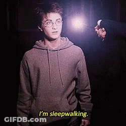 Harry Potter Is Holding A Wand And Says I 'M Sleepwalking . GIF