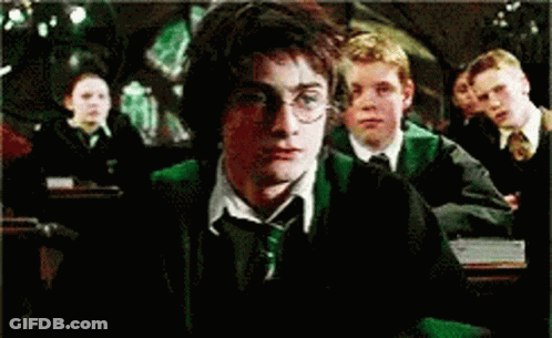 Harry Potter Is Sitting In A Classroom With Other Students GIF