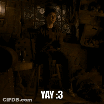 Harry Potter Is Sitting On A Stool In A Dark Room With The Words Yay : 3 Below Him GIF