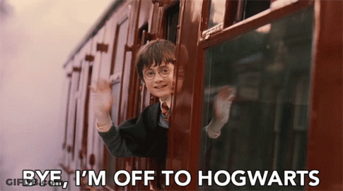 Harry Potter Is Waving From The Window Of A Train And Saying Bye I 'M Off To Hogwarts . GIF
