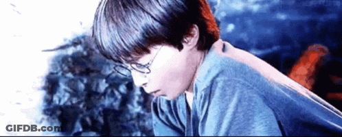 Harry Potter Is Wearing Glasses And A Blue Shirt In A Scene From Harry Potter And The Philosopher 'S Stone . GIF