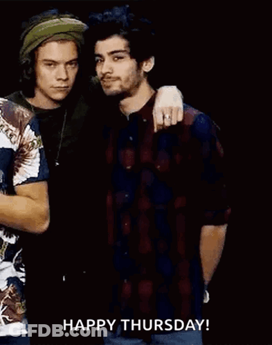 Harry Styles And Zayn Malik Are Standing Next To Each Other In A Dark Room . GIF