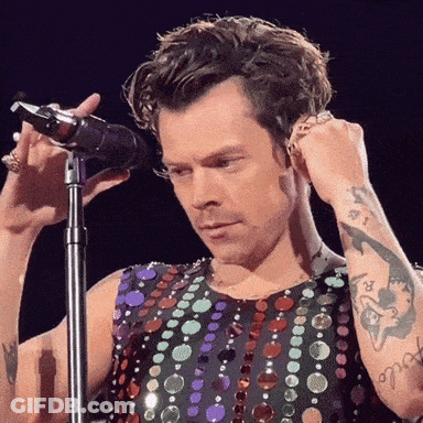 Harry Styles Holding Towel And Talking GIF