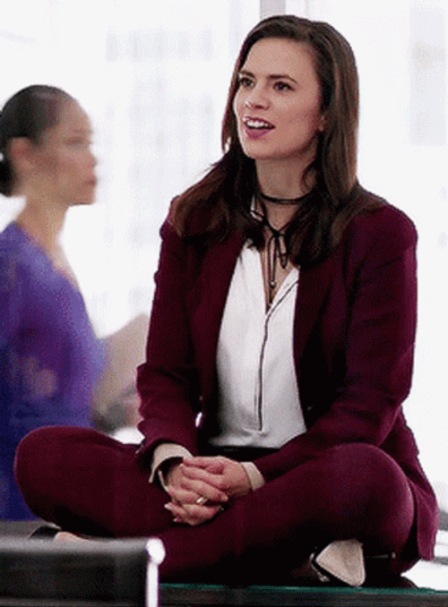 Hayley Atwell Gayly Talking Sitting On Table GIF