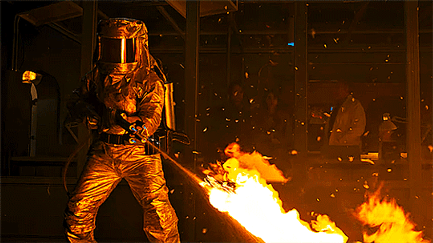 Hazmat Suit Firing Flame Thrower GIF