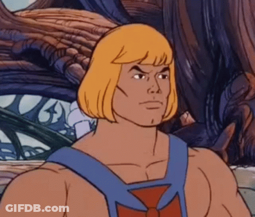 He Man From Masters Of The Universe Is A Cartoon Character With Blonde Hair And A Blue Vest . GIF
