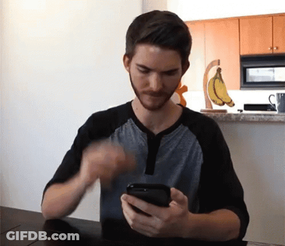 Head Scratch Guy Using Phone GIF