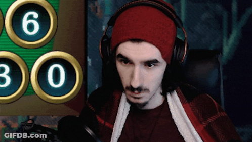 Headphoned Man In Red Hat At Screen 6&30 GIF