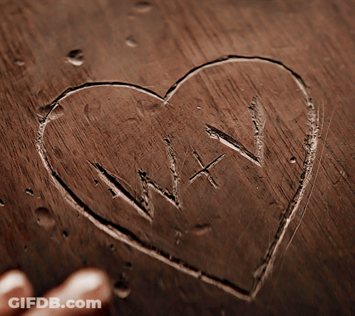 Heart Carved In Wood With Letters W And X GIF