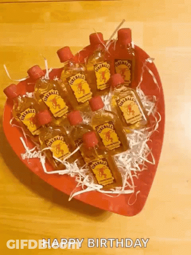 Heart Shaped Bowl With Fireball Liquor Bottles GIF
