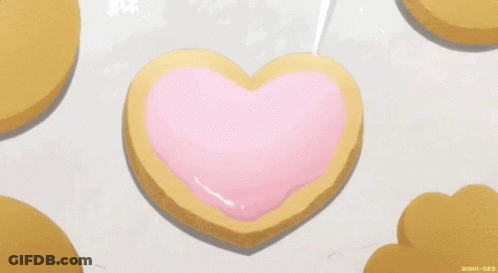 Heart Shaped Cookie With Pink Icing GIF