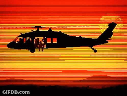 Helicopter Flying At Sunset With Man In Cockpit GIF